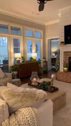 a living room filled with furniture and a fire place