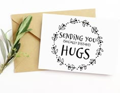 a greeting card with the words sending you equally instant hugs in a circle surrounded by greenery