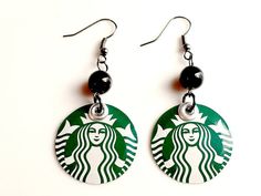 pair of starbucks earrings on white background