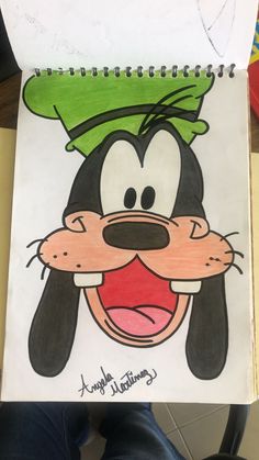 a drawing of goofy the dog with a green hat on his head