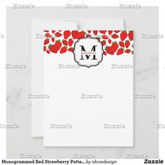 the monogrammed red strawberry pattern on this stationery