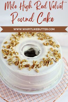 a cake with white frosting and gold sprinkles