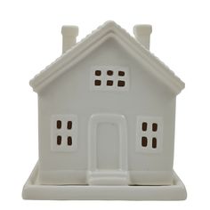 a white ceramic house with three chimneys