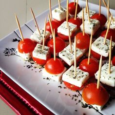 small appetizers with tomatoes and cheese on skewers