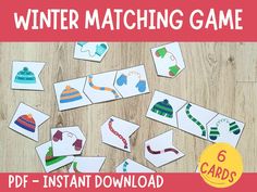 the winter matching game is shown on a wooden table