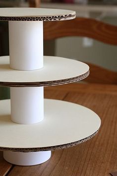 three tiered cake stand on wooden table