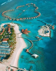 an aerial view of the resort and its surrounding lagoons in the middle of the ocean