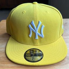 Brand New 59fifty 7 1/2 New Era Yellow And White Yankees Cap, Yankee Sign Center Cat New Era Logo On The Side, Baseball Logo On The Back Casual Adjustable Yellow Fitted Hat, Casual Yellow Adjustable Fitted Hat, Sporty Yellow Baseball Cap For Sports, Yellow Snapback Sports Hat, Sporty Yellow Baseball Cap, Yellow Adjustable Fitted Cap, Casual Yellow Snapback Hat, Sporty Yellow Cap, Yellow Snapback Baseball Cap