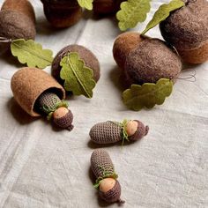 small knitted acorns and leaves on a table