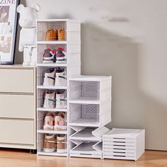 a stack of shoes sits in front of a dresser with drawers and baskets on it