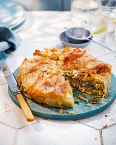 there is a pie that has been cut into pieces on the plate and ready to be eaten