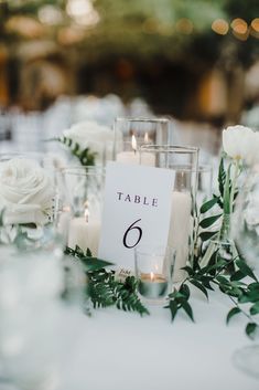 a table with candles and flowers on it