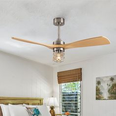 a bedroom with a bed and ceiling fan