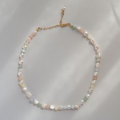 The delicate pastel-colored pearl necklace made of real freshwater pearls and colorful morganite gemstone beads completes every outfit with summery vibes. Whether worn alone as a choker or layered with other necklaces - the pearl necklace is perfect for festivals or parties, as wedding jewelry or as a gift idea for your girlfriend or mom. ➡️ Material and size Thanks to the gold-plated link chain and the 24k gold-plated stainless steel snap clasp, the necklace is adjustable in length (40-48 cm). Pastel Pearl Necklace, Colored Pearl Necklace, Pastel Jewelry, Pastel Necklace, Layered Beaded Necklaces, Morganite Gemstone, Trending Necklaces, Pearl Choker Necklace, Moonstone Necklace