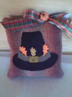 a small bag with a hat on it