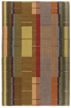 a multicolored area rug with squares and stripes on the bottom, in various colors