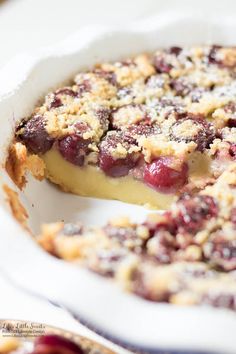 a close up of a pie on a plate with a piece missing from it's crust