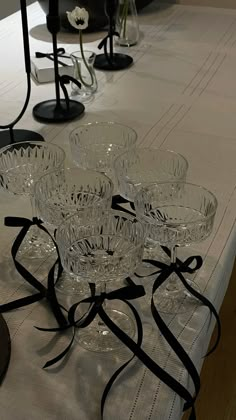 a table topped with lots of glass bowls