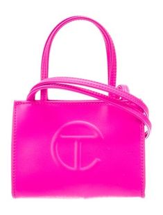 Telfar Crossbody BagPink Vegan LeatherSilver-Tone HardwareFlat Handles & Dual Shoulder StrapsTwill LiningSnap Closure at Top Hot Pink Telfar Bag, Pink Telfar Bag, Pink Telfar, Telfar Bag, Luxury Tote Bags, My Style Bags, Handbag Essentials, Girly Bags, Cute Nikes