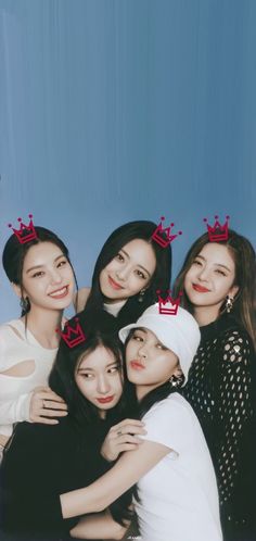 the girls are posing together with crowns on their heads