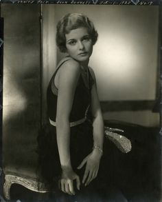 black and white photograph of woman in evening dress