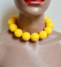 jewelry: big yellow beaded necklace --Very large yellow necklace bead material:  Acrylic clasp: stainless steel lobster clasp and a 2 inches adjustable chain Diameter: 30mm Shape : round  Luster: High body: clean Necklace length:  choose colour: 30 mm yellow beads Packing:Beautiful Pouch If you want to order of different style. Please feel free contact me . Thank you .  back to my store: https://www.etsy.com/shop/goodglasspearl?ref=l2-shopheader-name Luxury Yellow Round Beaded Necklaces, Adjustable Yellow Choker Jewelry, Adjustable Retro Necklace With Round Beads, Vintage Yellow Round Bead Necklaces, Adjustable Yellow Necklaces With Polished Beads, Adjustable Yellow Necklace With Polished Beads, Vintage Yellow Jewelry With Large Beads, Retro Adjustable Beaded Necklaces With Round Beads, Colorful Beaded Necklaces In Yellow