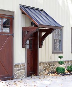 an outside view of a building with two doors