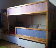 the bunk bed is made up and ready to be used as a child's room