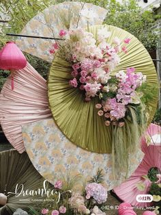 an umbrella decorated with flowers and other things in the background, is featured on this magazine cover