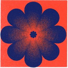 an orange and blue square with a flower in the center on it's side