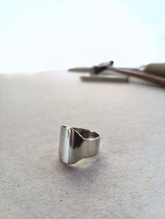 A design inspired by the nordic middle ages but with the neat touch that you always see in Annas jewelry. This ring gives a big impression but it's very confortable.  This ring is made of Sterling Silver 925 and its welded. Width: 18 mm (widest) Diameter: 19 mm Each piece in this store is unique and 100% handmade - one of a kind. That means that you get the piece that you see at this picture. Silver Ring Design, Viking Wedding Ring, Silver Coin Necklace, Rustic Rings, Silver Ring Designs, Viking Ring, Coin Necklace, Silver Coins, Bohemian Jewelry