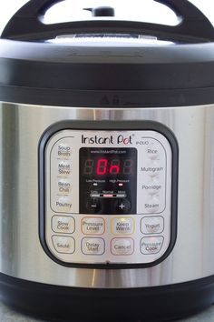 an instant pot is shown with the time displayed on its display screen and it's lid open