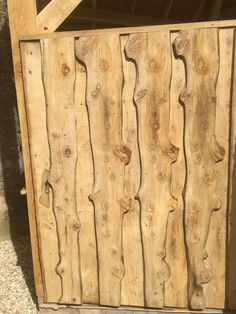 a close up of a wooden gate with wood slats on the outside and inside