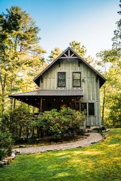 a house in the woods surrounded by trees