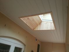 an open roof window on the side of a house