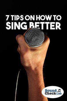 a hand holding a microphone with the words, 7 tips on how to sing better