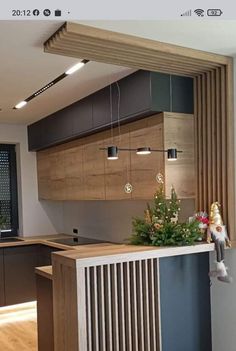 a kitchen with an island and wooden cabinets