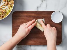 a person is making food on a cutting board