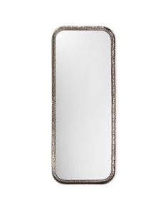 a silver rectangular mirror on a white wall