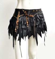 Skirt made out of black genuine leather. Detailed with large bear craws made out of polymer clay, brass color rivets and wooden beads. Snaps to get in and to adjust the size. Low waist. Size: Medium/Large High hip (waistband/belt level): 36-40" (92-102 cm) Average length: 11" (28 cm) This skirt can be made 1-3 inches smaller by adding more snaps, let me know if needed. This is an one of a kind item, the skirt you receive is the same one as above. Leather used in this one is recycled and industry Barbarian Costume, Dream Warriors, Warrior Costume, Tassel Skirt, Leather Ideas, Mystical Forest, Bear Claws, Wrap Mini Skirt, Viking Warrior