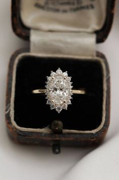 an antique diamond ring in a wooden box