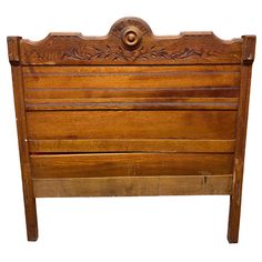 an old wooden headboard with carvings on the top and bottom panel, isolated against a white background