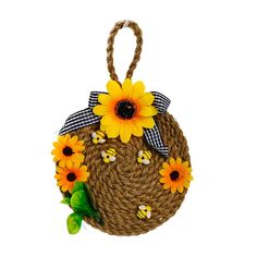 a straw bag with sunflowers on it