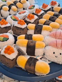 sushi stuffed animals are arranged on a table