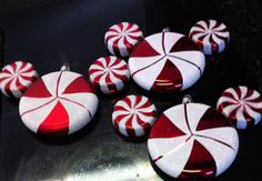 several red and white candy canes are sitting on a table