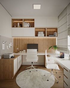 an office with white furniture and wood paneling on the walls, along with a round rug