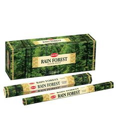 two boxes of rain forest incense sticks on a white background with trees in the background