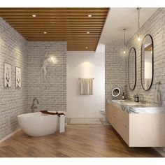 a large white bath tub sitting in a bathroom next to two sinks and mirrors on the wall