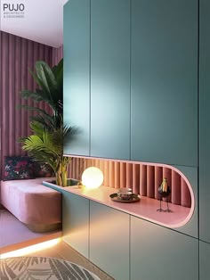 a pink and blue room with a plant in the corner