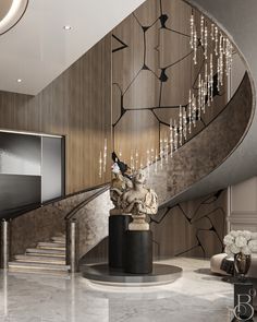 an elegant staircase with chandelier and marble steps leading up to the second floor